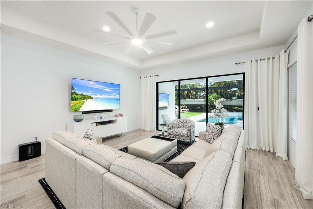 Great room with view/access to the enclosed lanai & pool area.