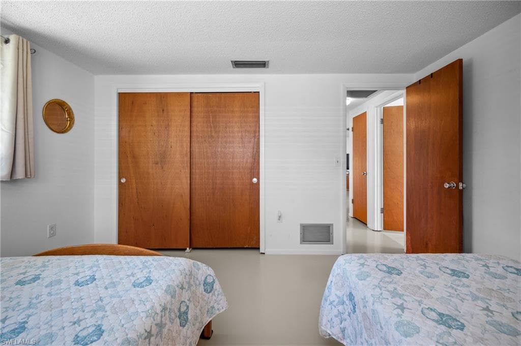 Interior room featuring light-toned flooring and white walls