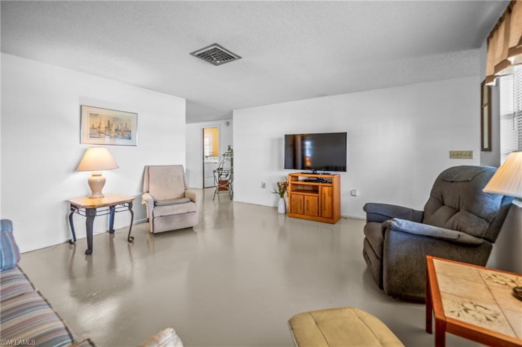Spacious interior with neutral wall colors and light-toned flooring