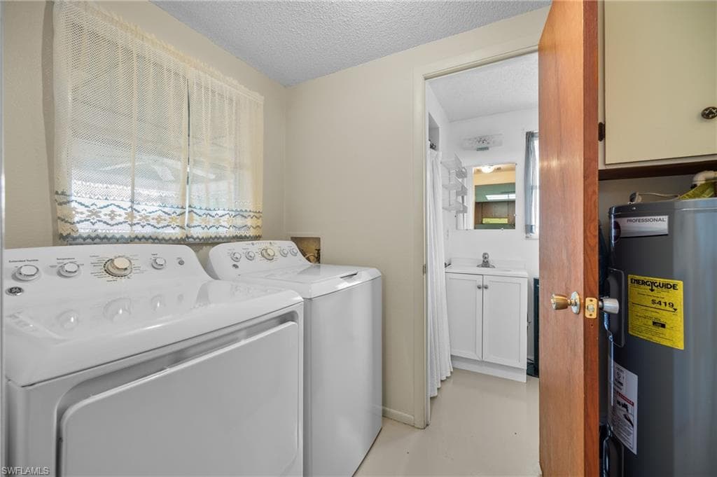 Dedicated laundry area featuring a washer and dryer