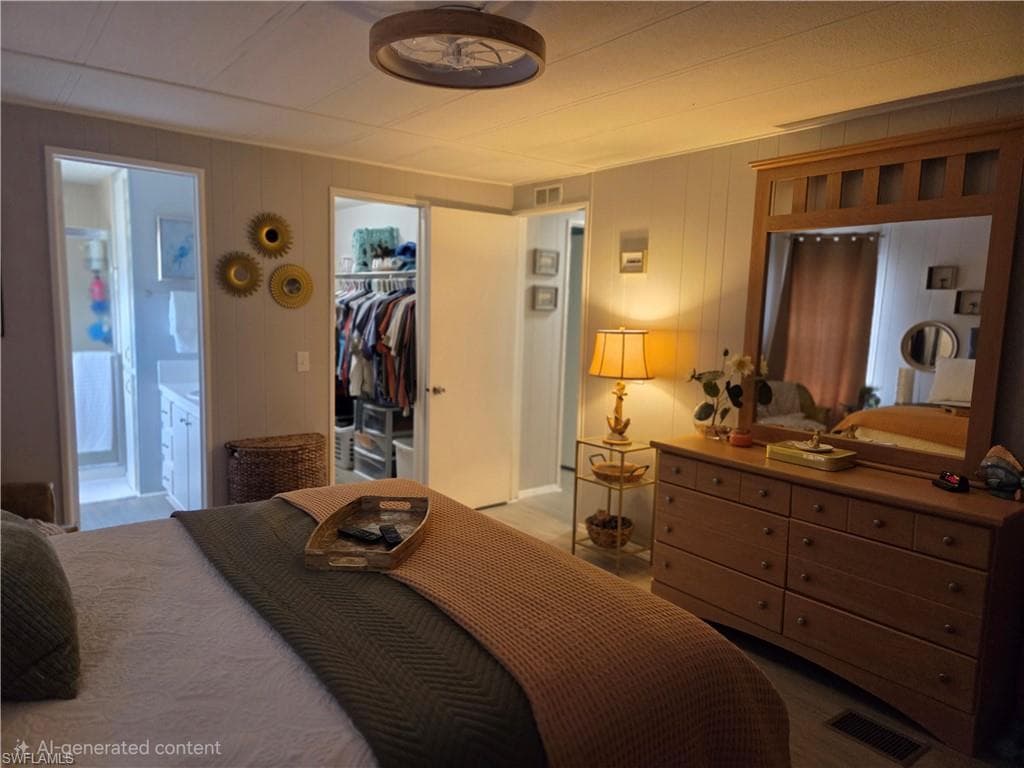 Primary bedroom with walk-in closet