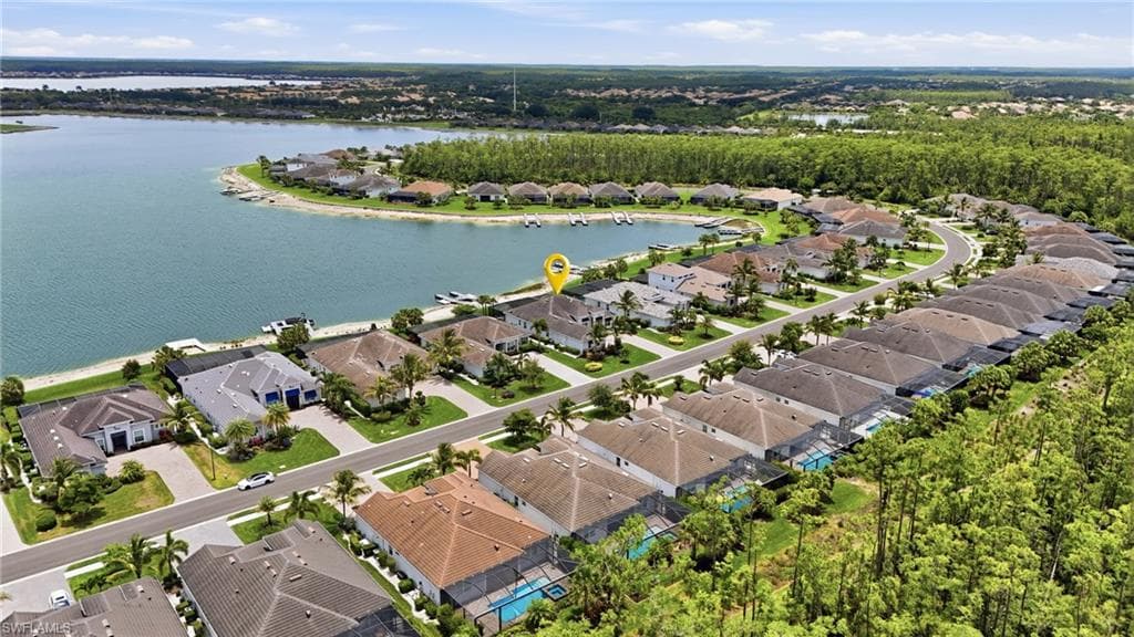 Aerial perspective showcasing a residential community with waterfront properties