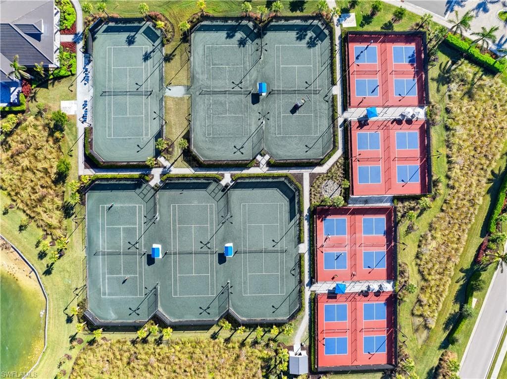 Aerial perspective showcasing multiple tennis and pickleball courts