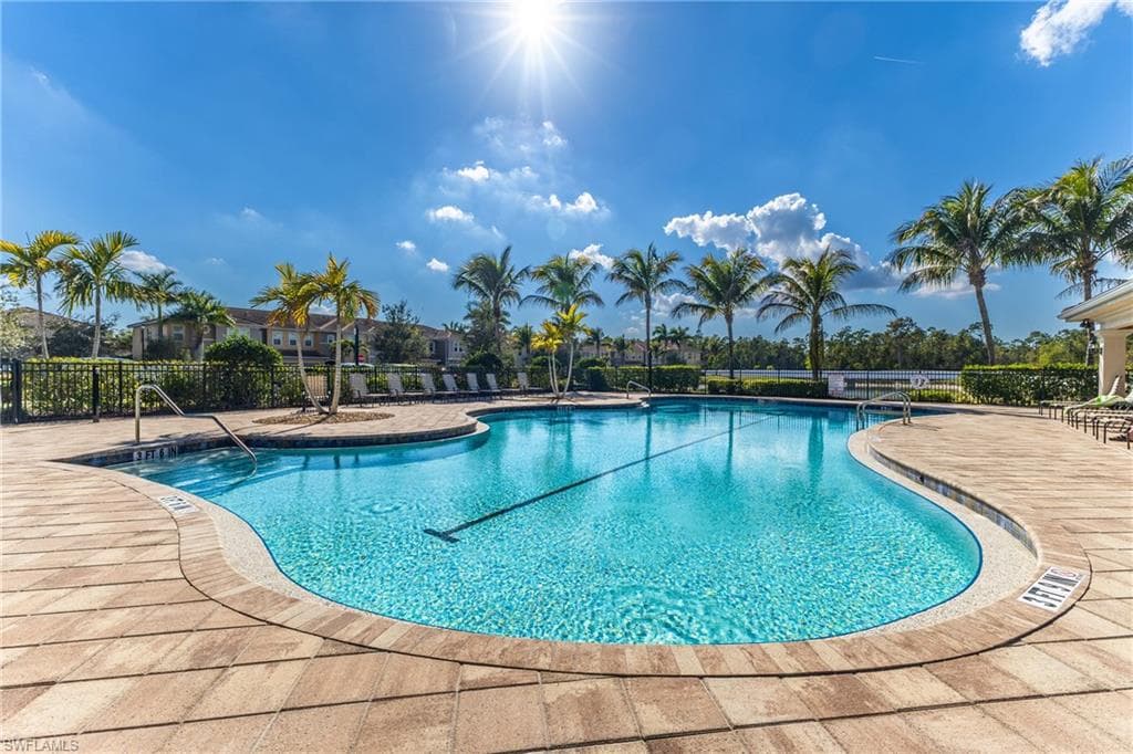 Community pool featuring a patio