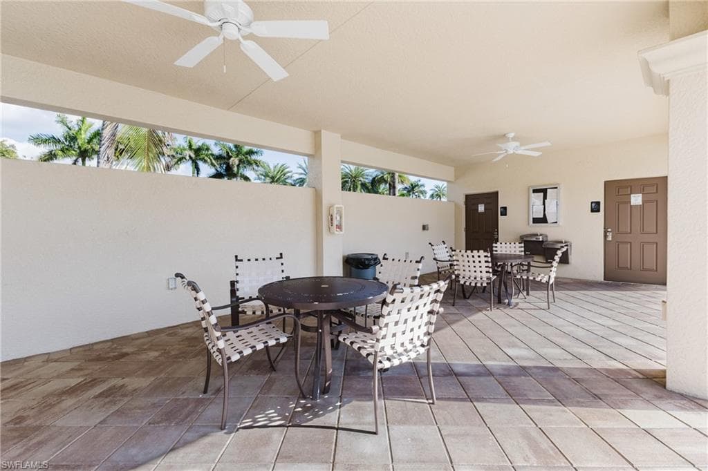 View of patio featuring outdoor dining space and a ceiling fan