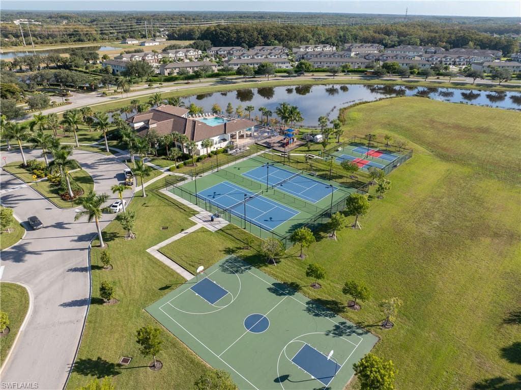 Aerial perspective of suburban area with a large body of water