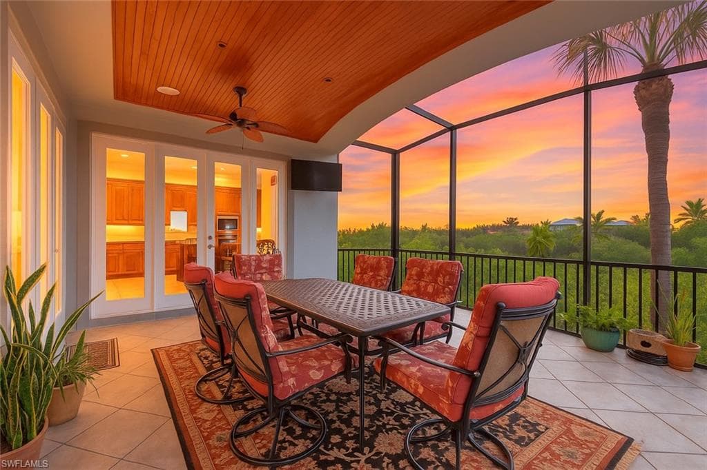 Stunning sunset views and serene, private living from the second level screened-in lanai.