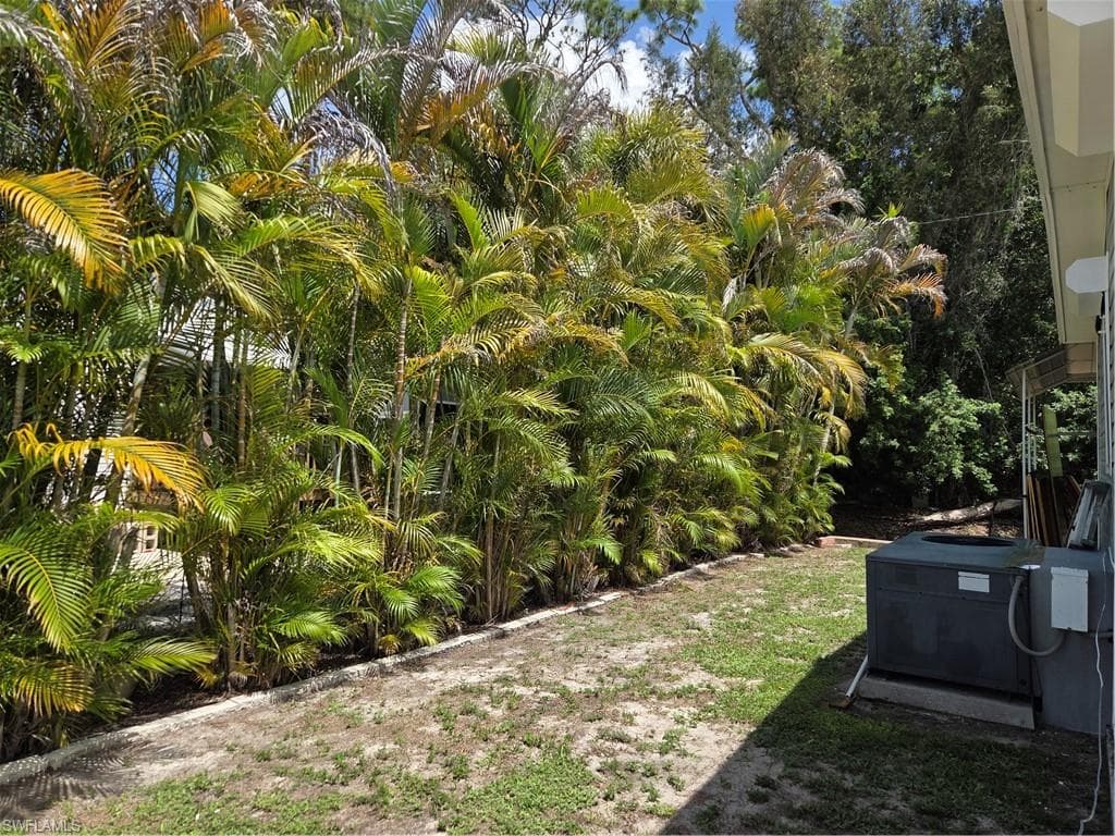 Tropical landscaping borders the rear of the property giving extra privacy.