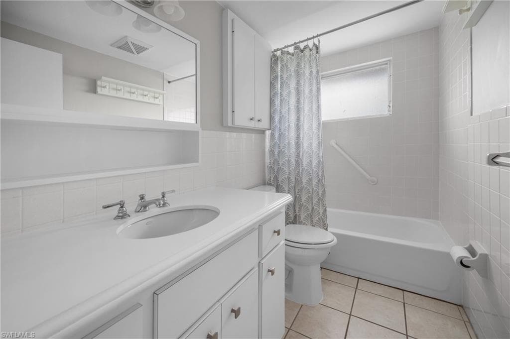 White vanity with an integrated sink and chrome faucet