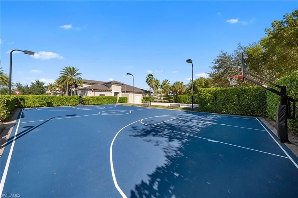 Regulation-size basketball court featuring a blue playing surface and white court lines