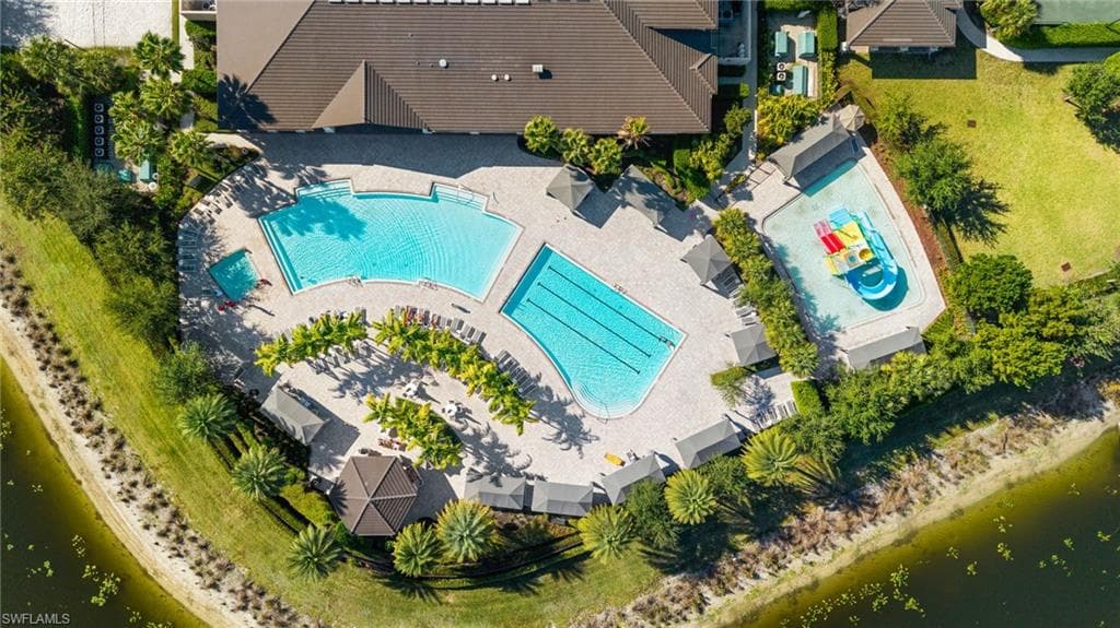 Expansive aquatic amenity area featuring multiple pools