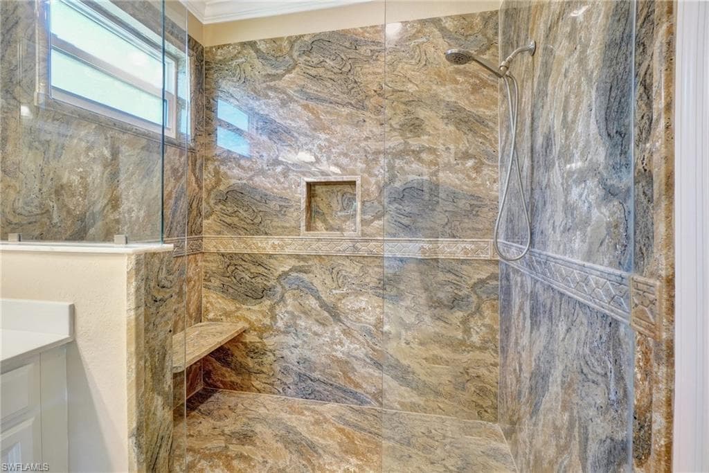 Custom surround and bench in the large walk-in shower