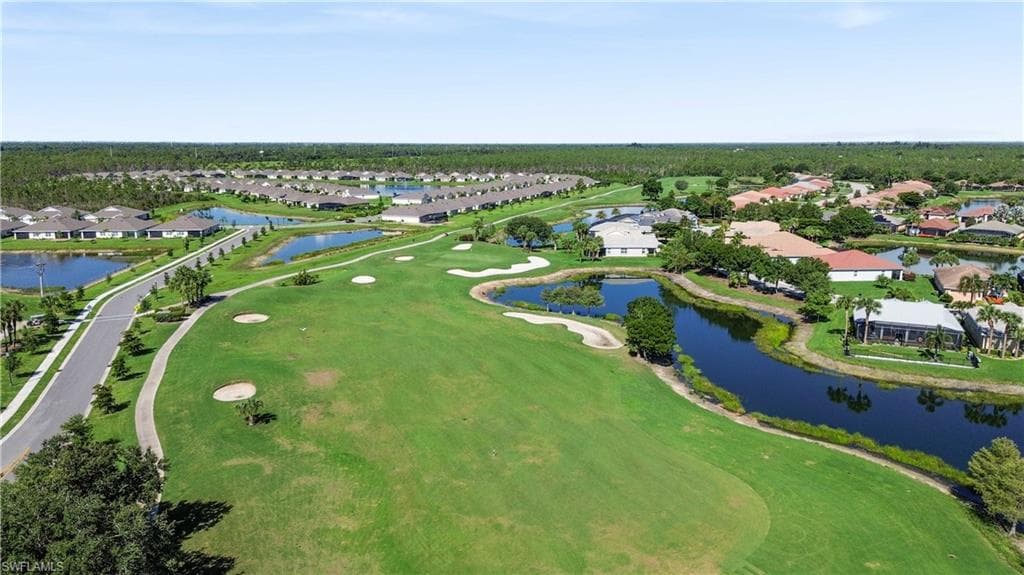 Expansive golf course frontage with manicured greens and sand traps