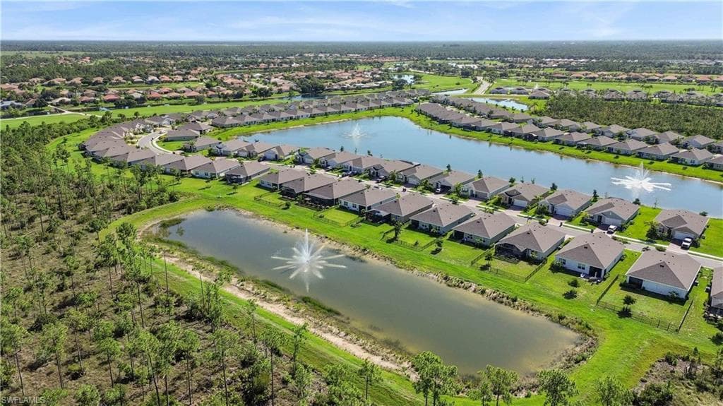 Aerial perspective of a planned community featuring a series of single-story residences