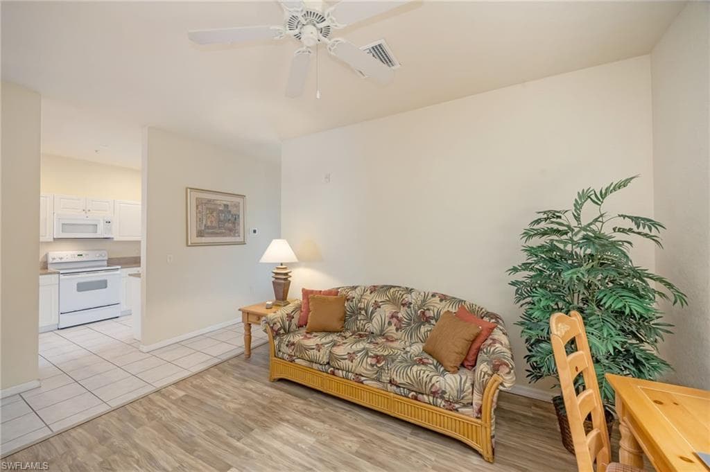 The versatile den can easily serve as a home office, media room, or additional guest accommodations.