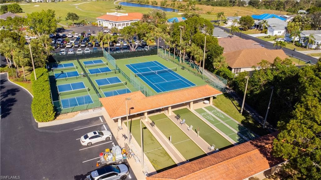 Recreational amenities featuring multiple tennis courts, several pickleball courts, and multiple shuffleboard courts
