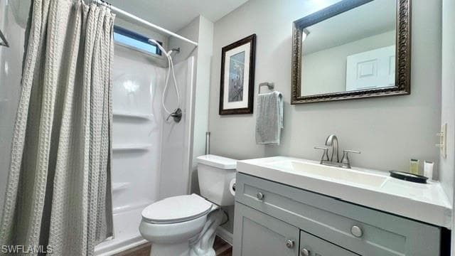 Contemporary bathroom featuring a light gray vanity with an integrated sink and brushed nickel fixtures