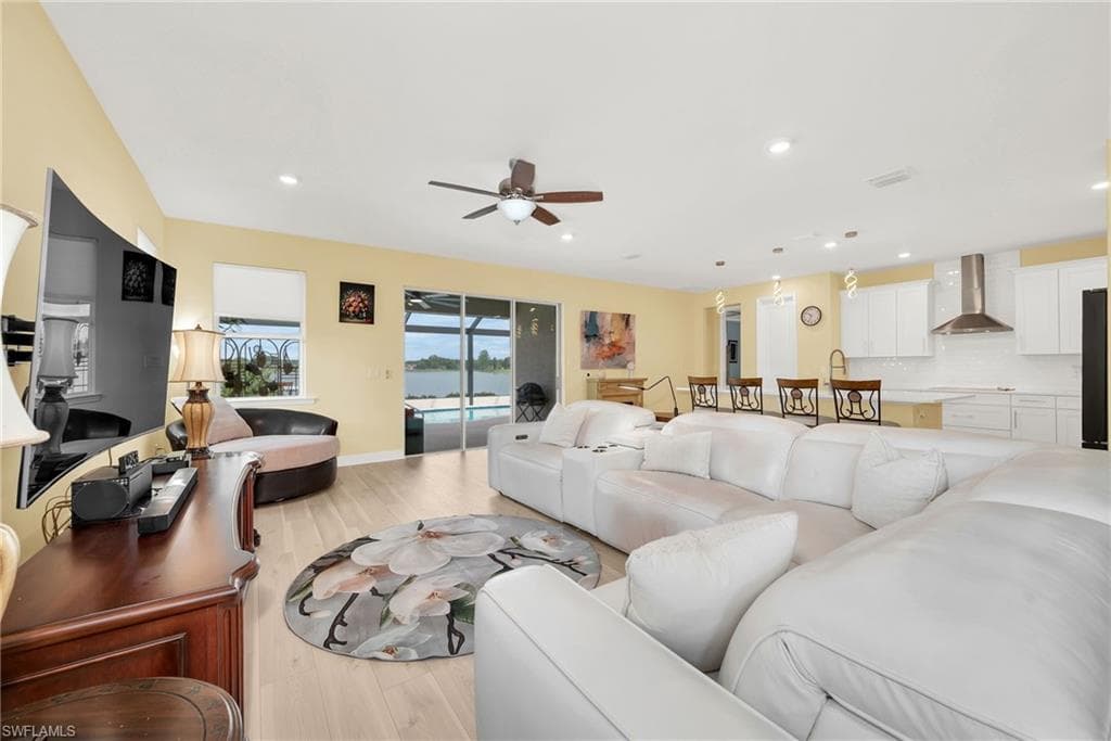 Open-concept interior featuring wood-finish flooring and a ceiling fan
