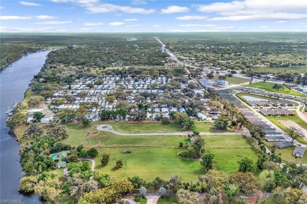 Bird's eye view with a water view and a residential view