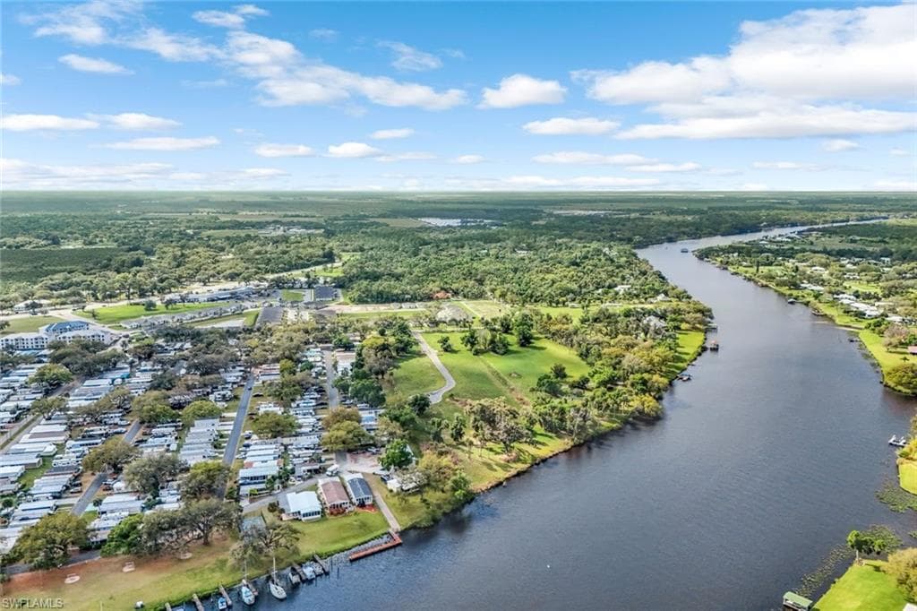 Aerial view featuring a water view