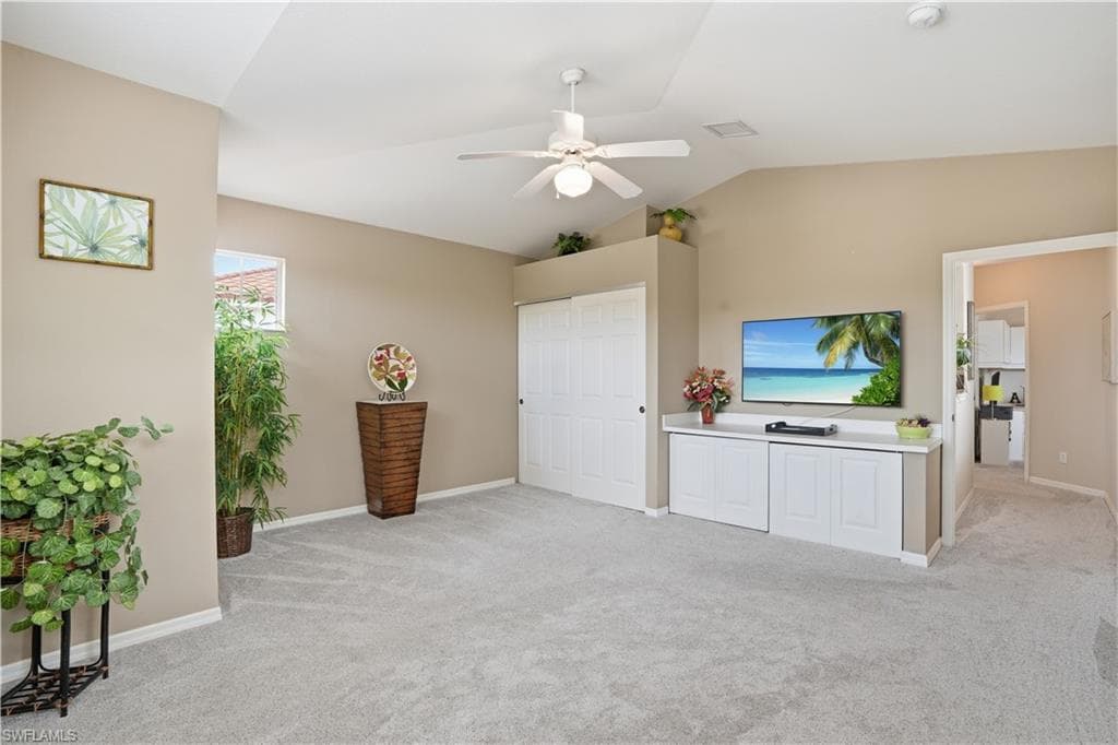Second guest bedroom offering vaulted ceilings and ample space for furnishings.