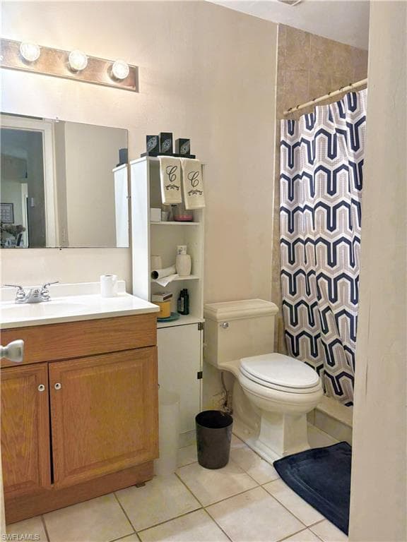 Bathroom featuring a light wood-finish vanity with a white countertop and integrated sink