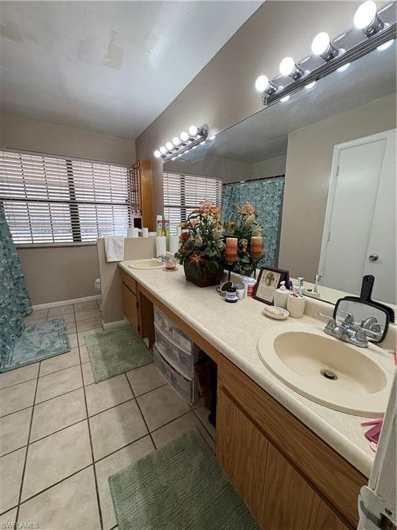 Dual vanity with integrated sinks, wood-finish cabinetry, and a full-width mirror