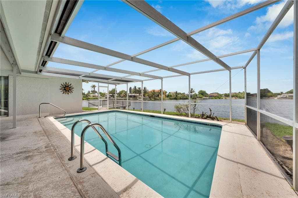 Screened swimming pool with integrated steps and stainless steel handrails