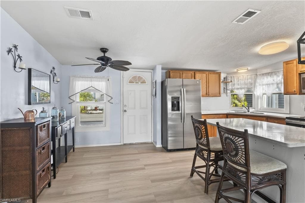 Spacious kitchen with bar seating area