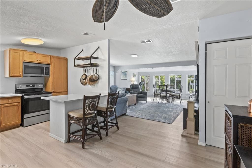 Vinyl flooring, coastal-inspired finishes, updated fixtures & tastefully renovated spaces create a comfortable, move-in-ready atmosphere