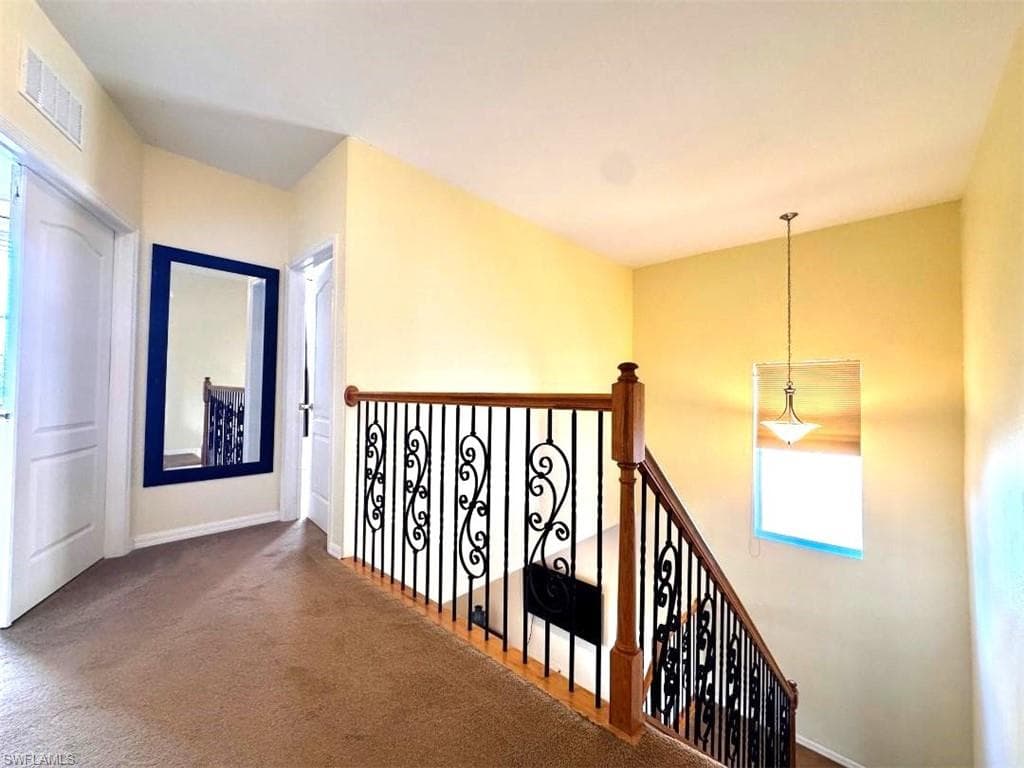 Hallway with carpet