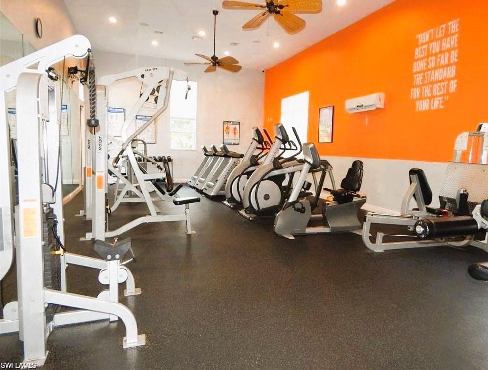 Exercise room with ceiling fan and an AC wall unit