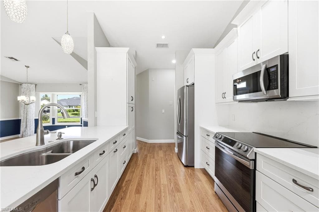 Updated kitchen with stainless appliances and quartz countertops.