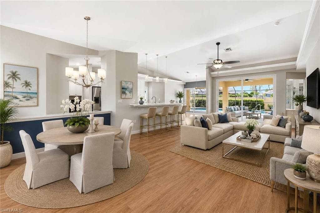 Open concept floor plan in North Naples home ; home looks as it appears, furniture is ai generated