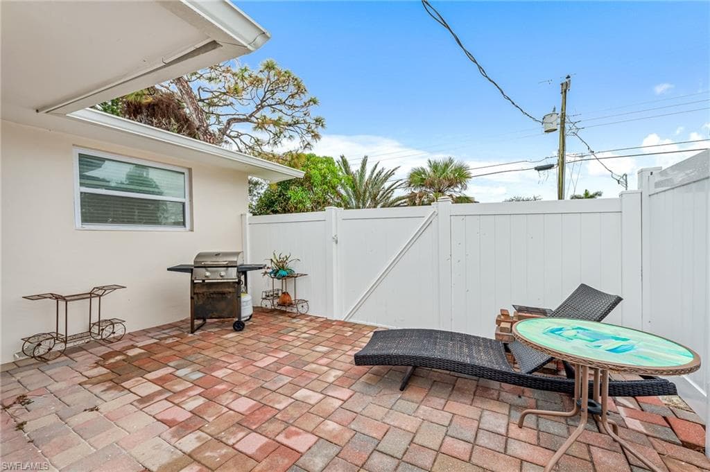 View of patio featuring area for grilling