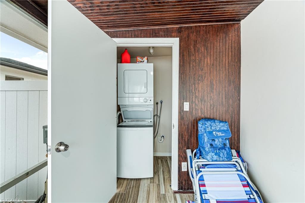 Laundry room with stacked washer and dryer