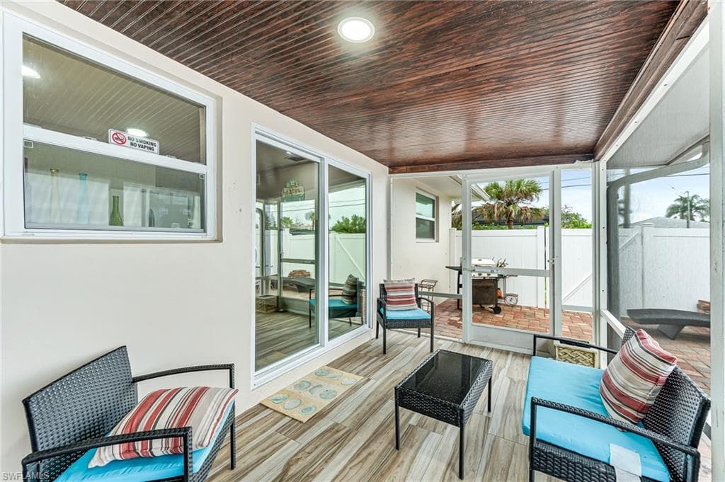 Sunroom / solarium with wooden ceiling