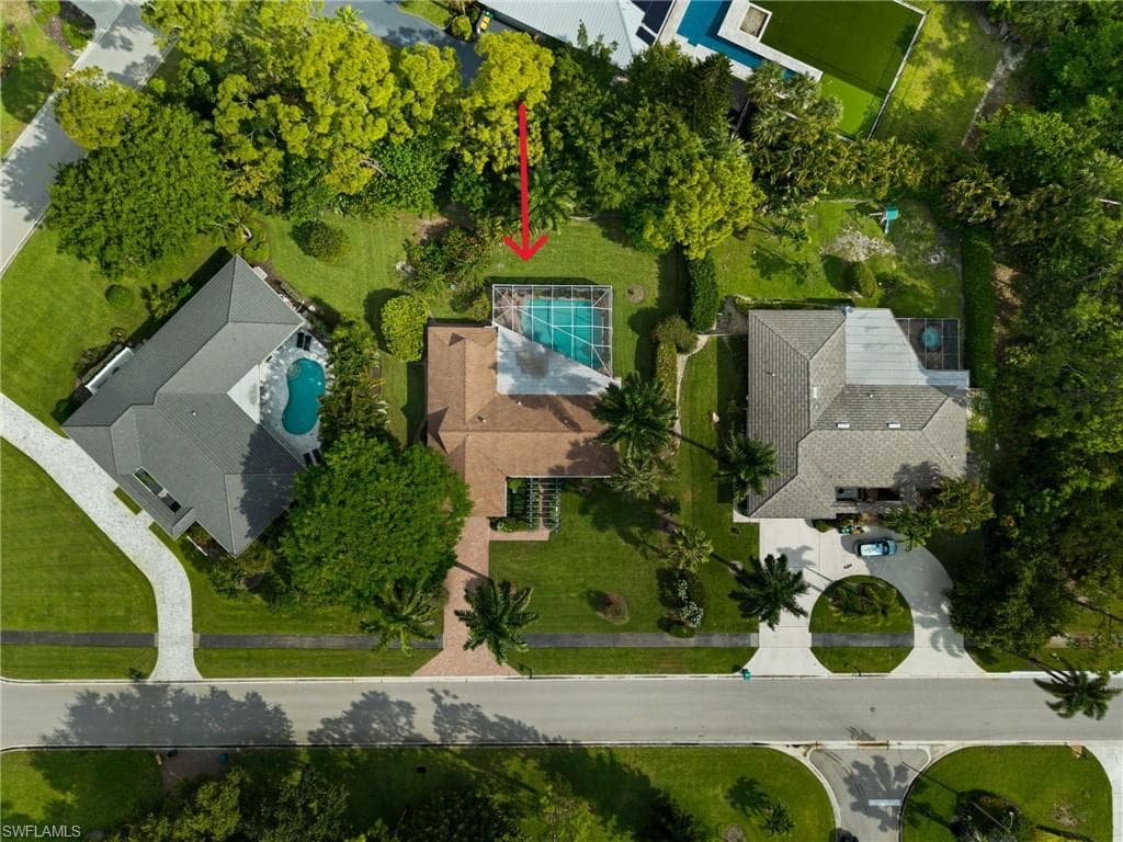 Set on a private, oversized lot framed by tropical landscaping