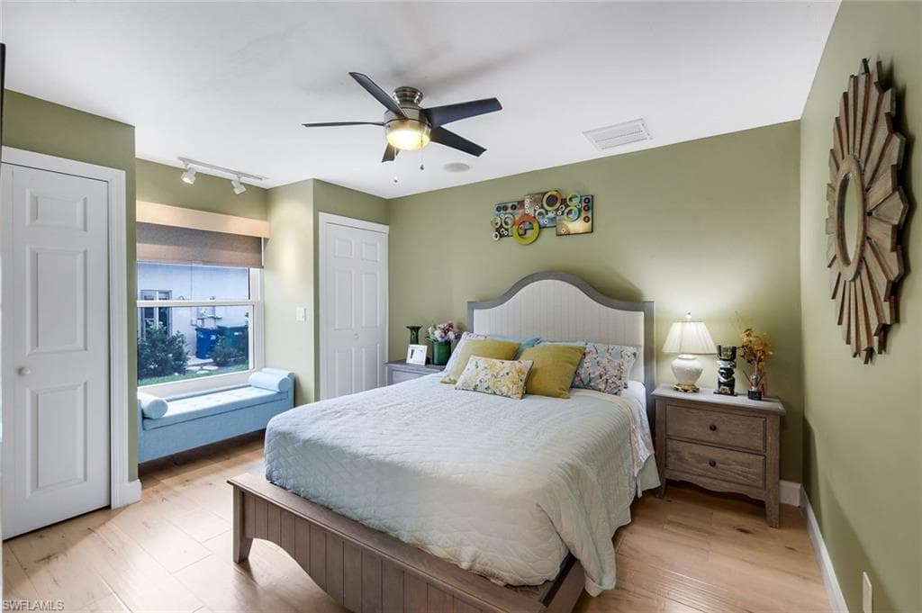Guest Bedroom I-11'x12'- Hurricane Rated Window, Custom Window Treatments, Tile Flooring- Looks Like Wood