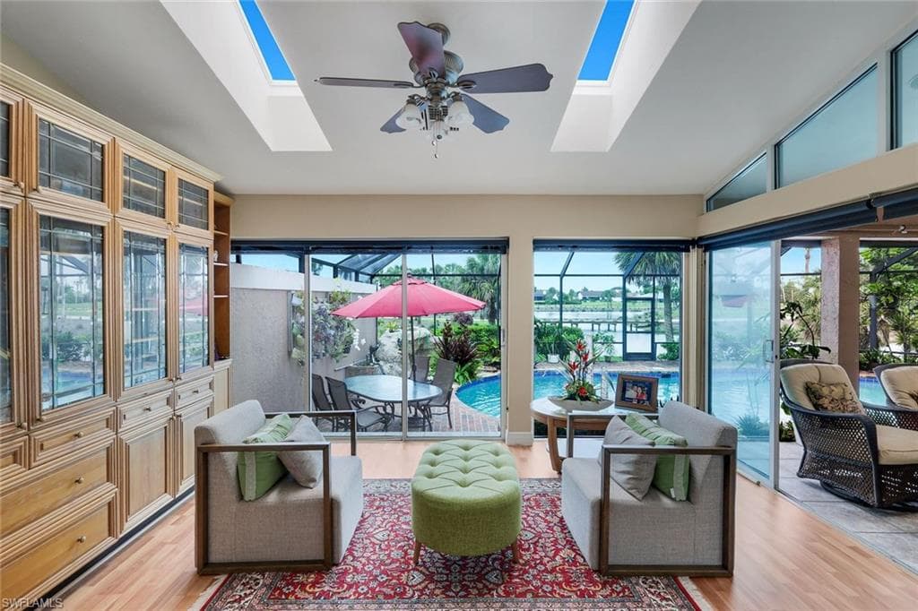 Located In the Primary Bedroom, Custom Built Ins, Glassed Living Area, Opens to Lanai, Skylights, Luxury Vinyl Tile Flooring