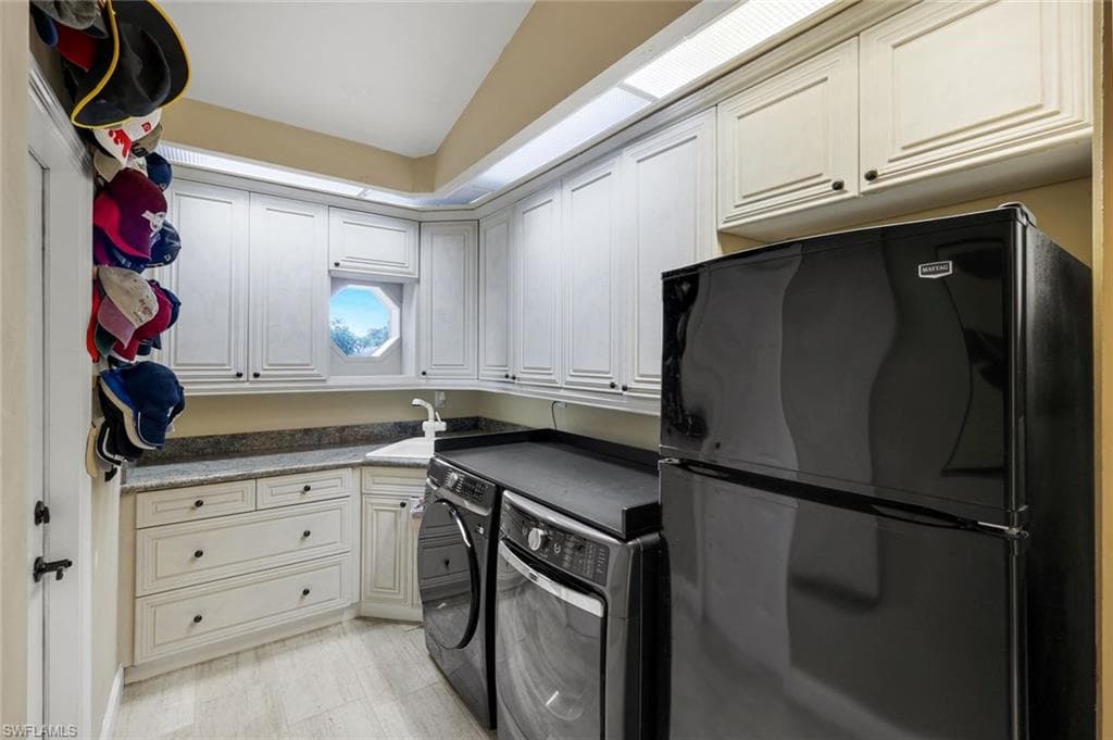 Front Load Washer, Dryer and Extra Fridg. Door to Garage