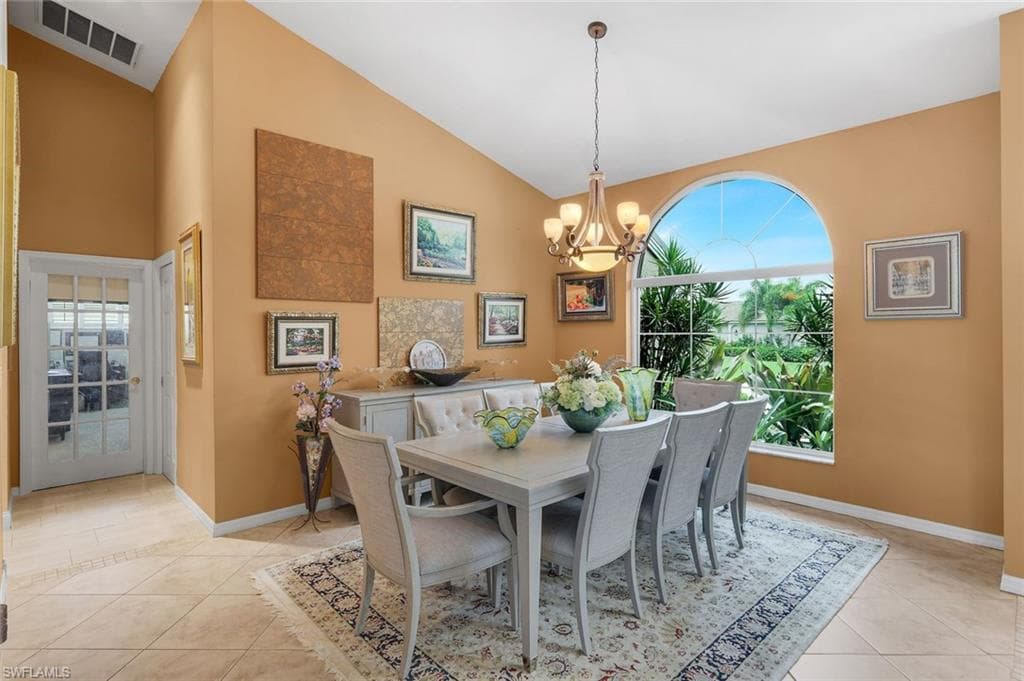 Expandable Dining Area, Tiled High Ceilings, Glass French Door to Den, Laundry Door is to the Right of Den Door