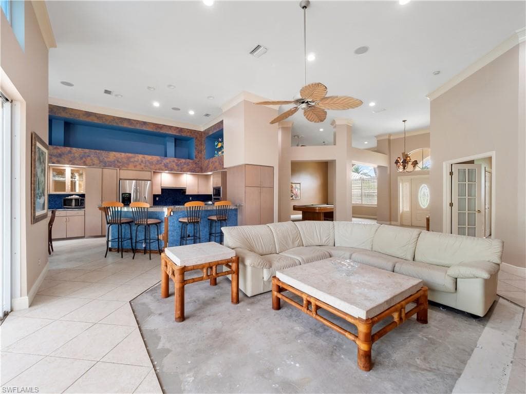 With approximately 13-foot ceilings and generous room dimensions, this living area provides the perfect foundation for a modern transformation.
