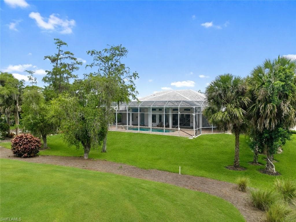 One of the property's standout features is its oversized backyard, where lush landscaping and generous green space create a private, park-like setting.