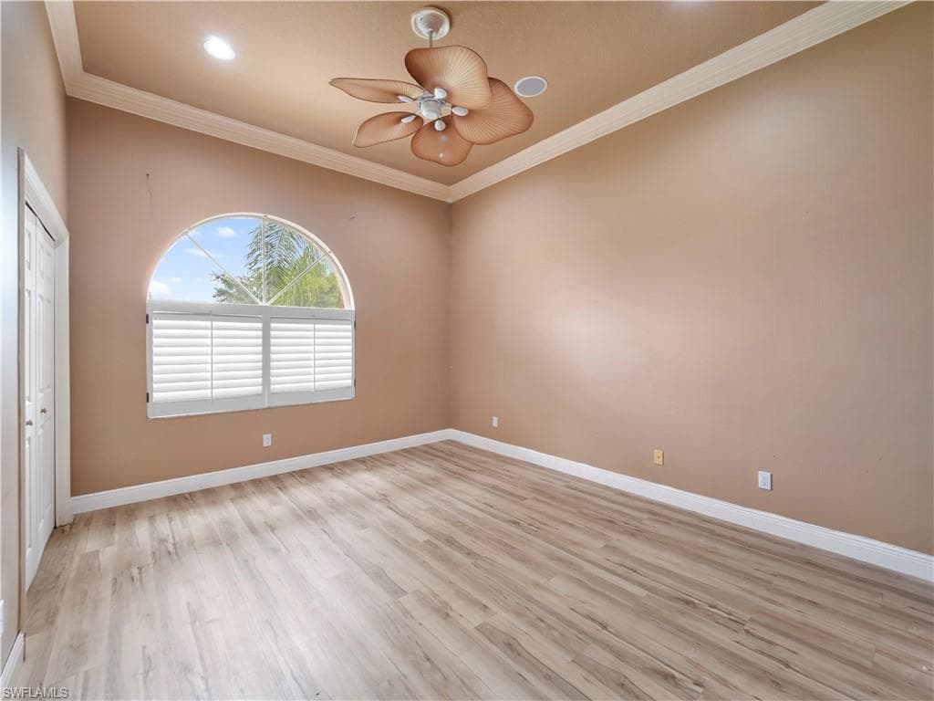 Large primary suite with ample room for a king-sized bedroom set and seating area, creating a comfortable sanctuary within the home.