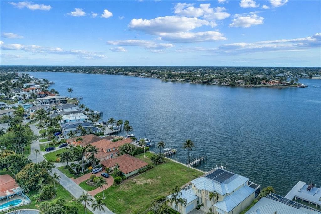 Aerial view of residential area with a large body of water
