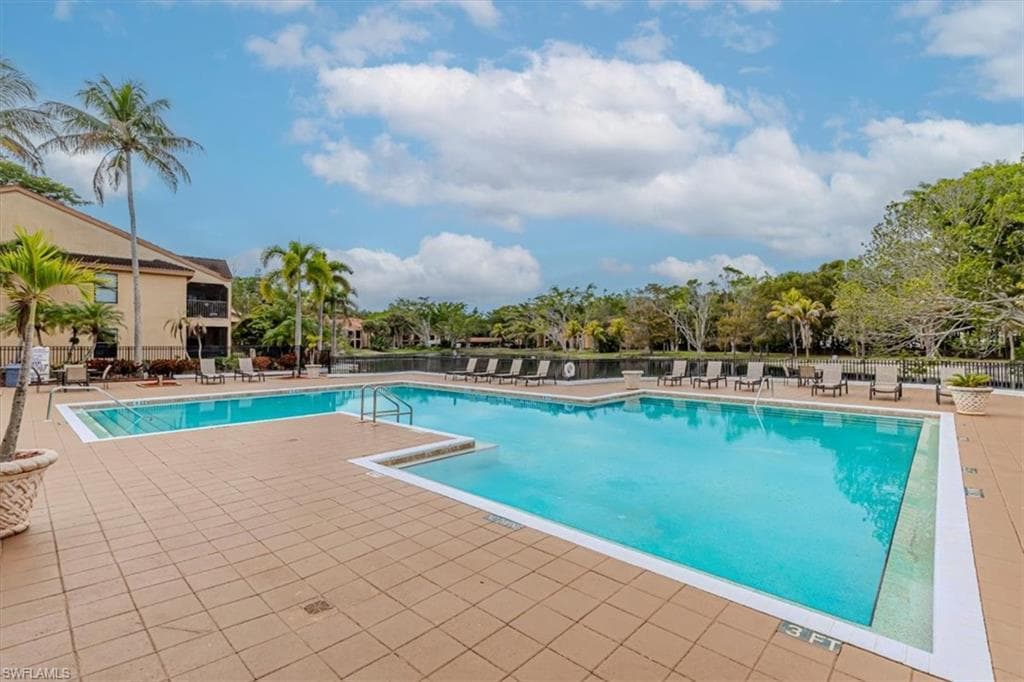 Community pool with a patio area