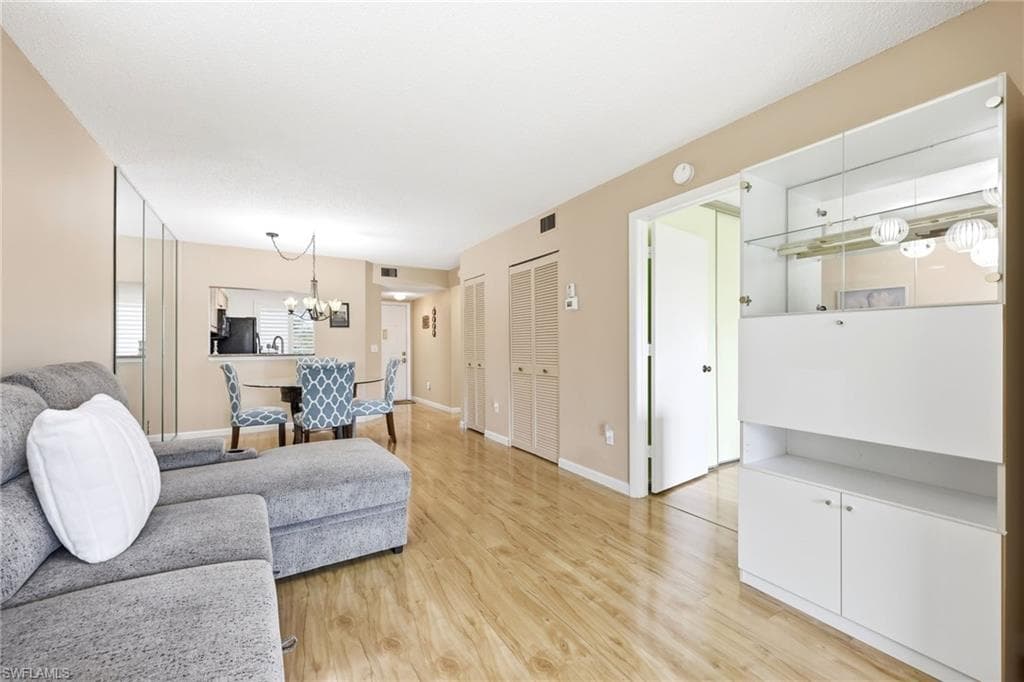 Open-concept living space with wood-finish flooring