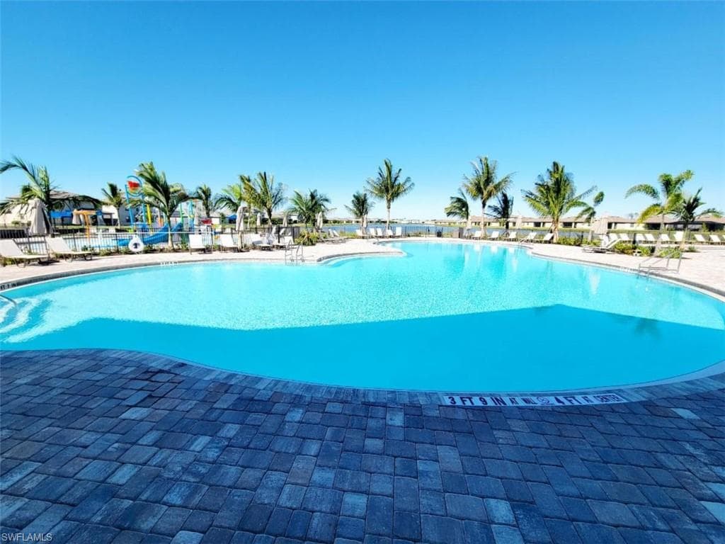 Community pool with a patio area
