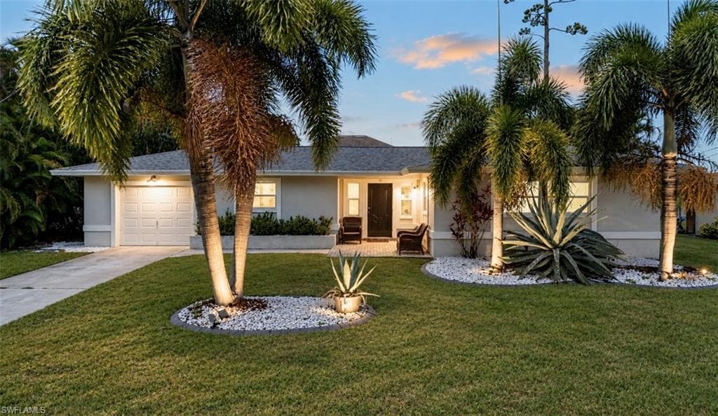 Tropical curb appeal with landscape lighting